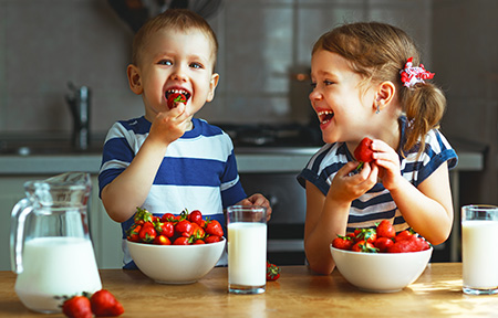Toddlers Eating Strawberries