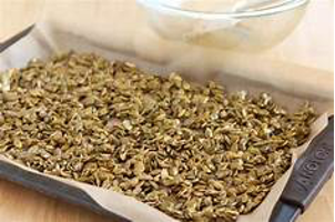 pumpkin seeds on tray ready for roasting
