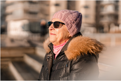 woman in winter hat and sunglasses